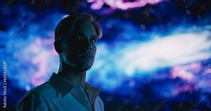 Expressive Portrait of a Handsome Young Man in White Clothes Posing for Camera in a Studio with Abstract Space Galaxy Art Animation, Transmitting a Sense of Grand Universe, Big Bang Theory, Science
