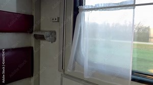 Inside the train car in the early morning. Passenger train inside the car with a coupe