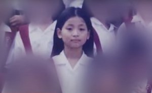 Grade school classmates recall Guo Hua Ping from class photos