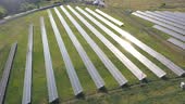 Rows of solar panels installed on field. Aerial shot of solar power...