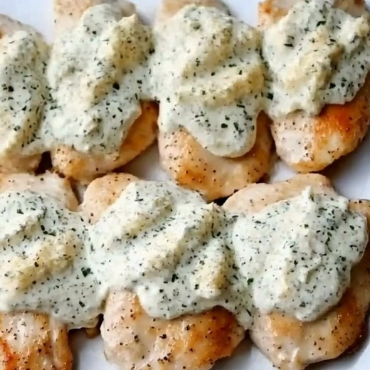 Quick & Easy Creamy Garlic Chicken Ingredients: 1. Chicken 2. Cream cheese 3. Minced garlic 4. Italian blend cheese 5. Cheddar cheese 6. Italian seasoning Directions: Preheat Oven: 1. Preheat your oven to 375°F (190°C). Line a baking sheet with parchment paper or lightly grease it. Prepare the Chicken: 2. In a mixing bowl, combine the cream cheese, minced garlic, Italian blend cheese, and Italian seasoning. Mix well. Bread the Chicken: 3. Place the chicken breasts on a cutting board and make a p