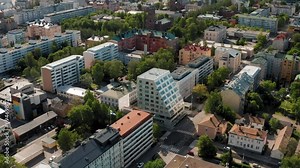 Wide aerial orbit shot of Typical European City Architecture with a mix of old and modern buildings in Northern Europe