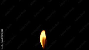 Closeup candle fire flame isolated burning on black background, slow motion HD