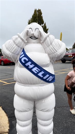 Michelin Man spots self in passenger seat of ultra sleek, ultra silent torque machine. | Michelin