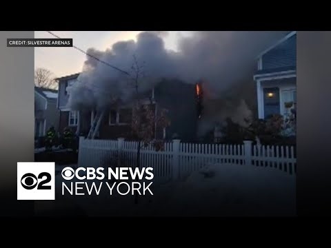 Police body camera footage shows trapped residents rescued from New York house fire