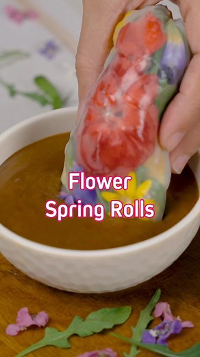 In honor of our LGBTQIA friends and readers, we made these beautiful (and edible!) flower spring rolls! 🌈 Recipe in link in bio. These colorful spring rolls were made by putting together different ingredients — fresh rice noodles, eggs, crab sticks, and edible flowers, and more, served with a savory peanut sauce. It's (delicious) proof that our differences can be brought together to create something wonderful, especially when we remember that just like these edible flower spring rolls, we are a