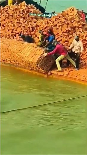 Unloading bricks from a barge into water using the domino method