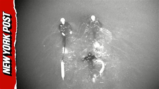 Surfer swept out to sea clings to buoy as drones lead rescuers to dramatic save