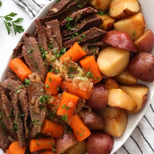 Braised Brisket slow cooked in the oven with potatoes, carrots, and onions makes for an incredibly flavorful meal. PRINT RECIPE: https://www.skinnytaste.com/braised-brisket-with-potatoes-and/ | Skinnytaste