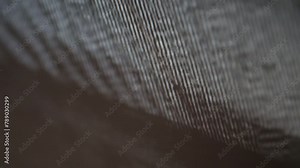 Extreme close up of a digitial computer device screen displaying a strobing static noise signal.