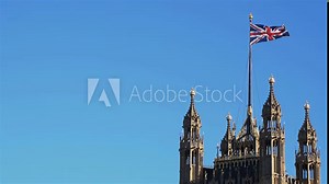 Union Jack loop. Slow motion Union Jack flag on the Central Tower of the UK parliament building. Loops.