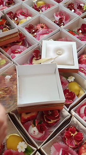 Intricately Decorated Boxes with Colorful Contents