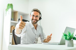 A Mature analyst man using laptop computer in office.