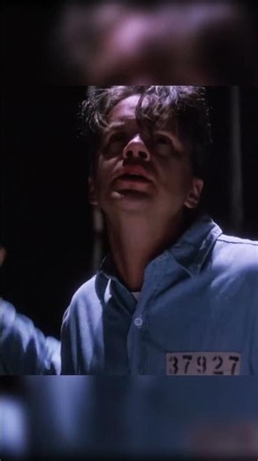 Andy escapes Shawshank Prison and stands in the rain with his arms raised after years of planning.