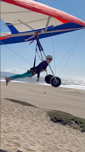 Full hang gliding flight under 1 min with gusty hovering and top landing at the beach