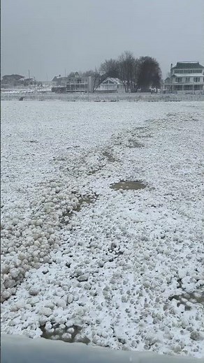 Ice balls pack Lake Michigan channel as frigid temperatures grip lakeshore