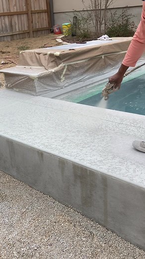 Beautiful Backyard Oasis Featuring a Textured Concrete Pool Deck