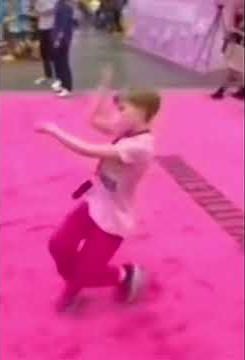 Kid slays on pink carpet