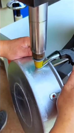 Riveting a Handle to an Aluminum Pot.