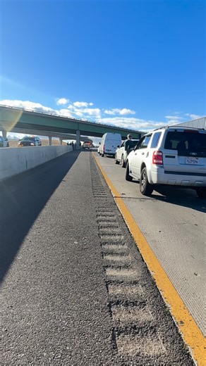 On 205/580 freeway, we have been in one spot for an hour and 15 minutes. A tanker truck flipped with hazardous material inside and highway patrol won’t let us go by on the freeway. This is a freaking mess!! | Debbie Burness