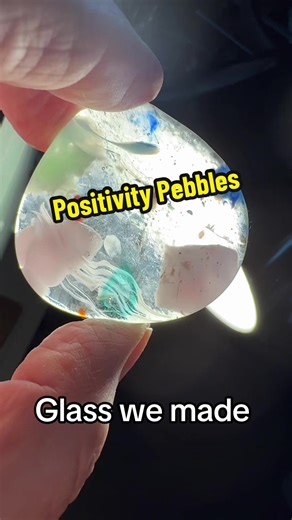 These are Positivity Pebbles we made with glass here in our studio. I love them! #glass #fusing #fusedglass #art #artistsoftiktok