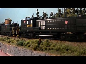 PRR ALCO RS-3 Locomotives Passing the Water Tower with 42 Car Train