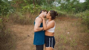 Romantic Couple Kissing Lustfully while Jogging, Boyfriend kiss her passionately as they walk, Lover share an intimate moment, Woman kisses to man deeply, Foreplay outdoors in active wear, Making love