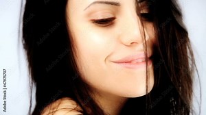 Beautiful woman blowing kiss in studio