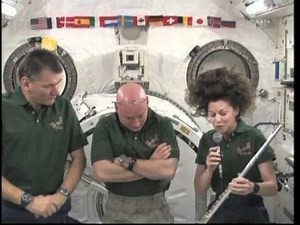 Astronaut Cady Coleman plays flute on space station