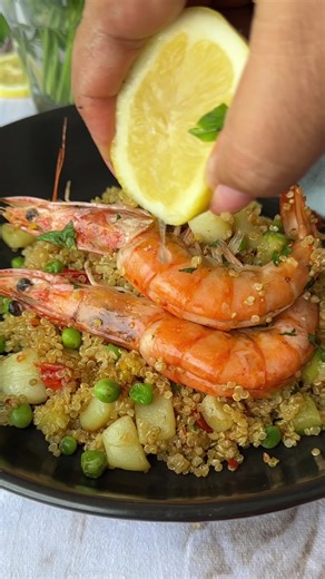 High Protein Savory Quinoa! 🥘🍤 You can make this healthy version of paella in your own kitchen with simple ingredients like quinoa, vegetables, seafood and saffron. You don't even need a paella pan to make the dish!! This is such a comforting dish, you'll make it again and again!! Ingredients 1 cup quinoa, washed in cold water 1/2 Lb shrimp with the shell on, clean and deveined 1 white squid, cut into small cubes 1 zucchini, cut into small dice 1 red pepper, cut into small dice 1/4 cup trozen 