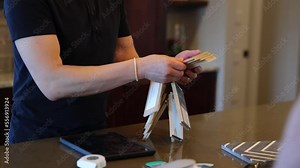 Couple testing different kitchen counter samples for their home renovation