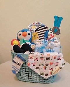 Newborn Gift Basket delivered It includes : 3 rompers, 3 pair of socks, towel, booties, bib, cap, baby scissors, booties, soft toy and props. | Mummy and MiniMe