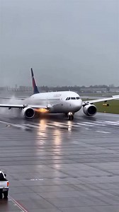 A harrowing scene was captured by a security camera at a regional airport when a commercial jet's landing gear failed upon touchdown during a heavy storm. Dateline: Chicago, Illinois – December 12, 2025. Story: Amidst rain and strong crosswinds, the white passenger jet touched down at a sharp angle, causing the right landing gear to collapse instantly. The engine cowling slammed into the rain-slicked asphalt, igniting a violent trail of orange sparks as the aircraft veered wildly off the runway.