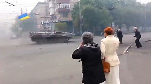 Saint Javelin on Instagram: "Ukrainian Major General Mykhailo Drapatyi was recently appointed as new commander of Ukraine’s land forces. This iconic video taken in Mariupol on May 14, 2014 shows a young Drapatyi blasting his Ukrainian BMP through barriers put up by Russian forces during their failed attempt to take over Mariupol. Shared by Oliver Carrol of the Economist"