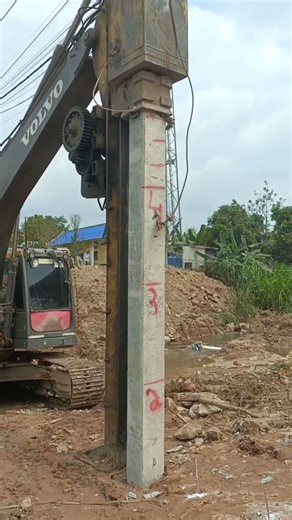 concrete piles driving by excavator