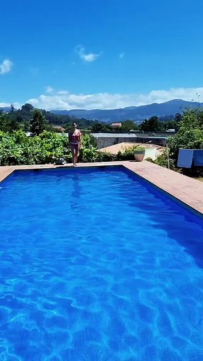 Summer Pool Fun: Woman Enjoys Clear Blue Waters