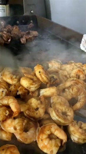 Restaurant-style hibachi right at home 🔥 Steak, shrimp, salmon Would you tear this plate up? 👀