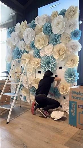 Set up a white, cream and blue paper flower wall, backdrop with me for a wedding #paperflowers #diy