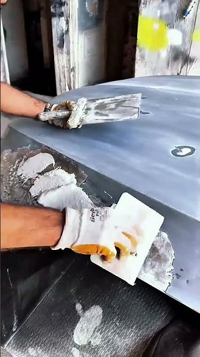 Covering damaged car hood to protect surface temporarily