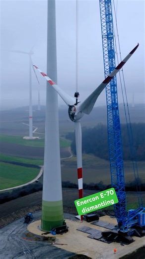 The heavy rotor of an Enercon E-70 windturbine on the hook of a huge crawler crane. #asgreenconsult