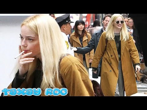 Emma Stone smokes a cigarette while filming new Netflix series Manic