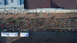Download Aerial view of marathon runners on the streets of Kyiv Ukraine