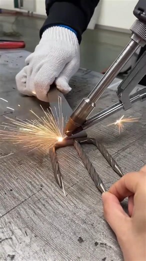 Handheld Laser Welding an Iron Rake Head.