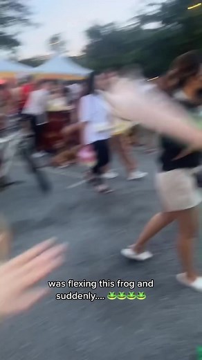 Playful Frog Mascot Poses For Photos