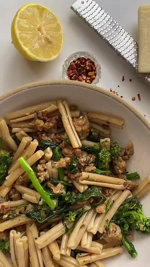 “SAUSAGE AND BROCCOLI RABE PASTA 🍝🥦 & This dish is one of my nearest and dearest. I can (and do) eat this for nights on end without getting sick of it and I love it's simplicity. Any other sausage broccoli rabe lovers out there?! INGREDIENTS: 1 lb sweet Italian sausage 1 head broccoli rabe 1 oz grated pecorino romano plus more for topping 1/2 lemon 3 cloves garlic 2 tbsp extra-virgin olive oil salt INSTRUCTIONS: 1. Bring a large pot of salted water to a boil 2. Brown sausage: Remove sausage fr