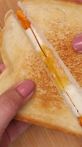 This grilled cheese and egg sandwich is a hearty grilled cheese recipe that's easy to make and the perfect dish for a quick breakfast, lunch, or snack. #breakfastideas #breakfast #breakfastsandwich #GM #goodmorning #grilledcheese #easyrecipe | Kitchen Divas
