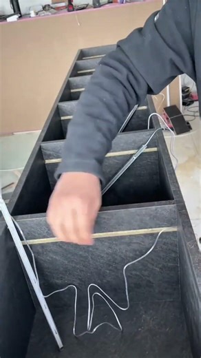 Inserting an electrical cable into a ceramic surface to be installed as an electrical connection