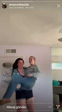 6'5 tall beautiful Amazon cradle carry her short friend