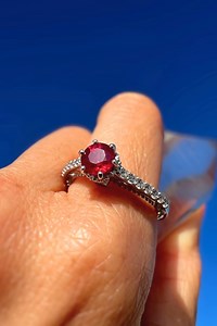 Consider this exquisite Ruby ring with a regal design that will elevate your jewelry collection. This ring boasts a round cut red Ruby gemstone that exudes elegance and sophistication. The cathedral filigree design in this enchanting piece will take your breath away with its sparkling accent stones. Whether you're treating yourself or looking for the perfect gift for a loved one, this Ruby ring is a beautiful choice for someone looking for a memorable design. Makes a stunning gift for a July bir