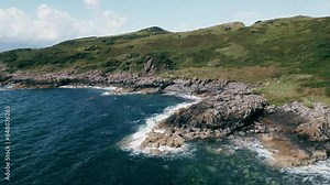 Isle of Bute, UK, July 2023, view of the cliffs and rocks on the south coast
